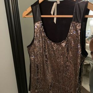 Sparkle in this loose fitting top out on the town